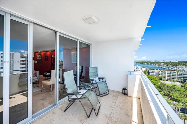 a living room with lots of furniture and a large window