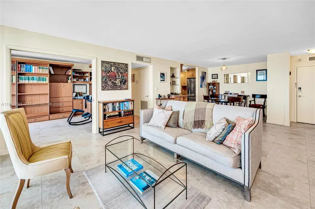 a view of swimming pool with a building and trees in the background