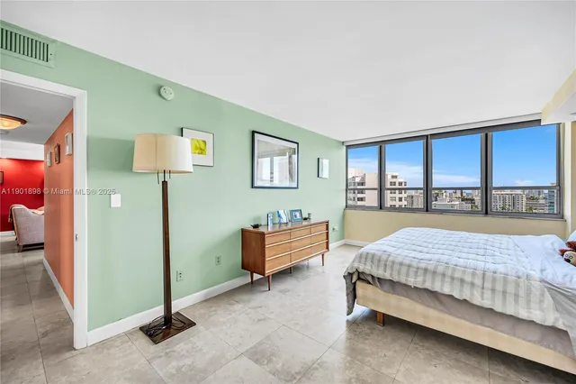 a spacious bathroom with a double vanity sink and a mirror