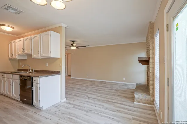 a kitchen with stainless steel appliances granite countertop a stove and a sink