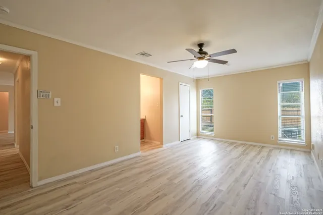 a view of hallway with wooden floor