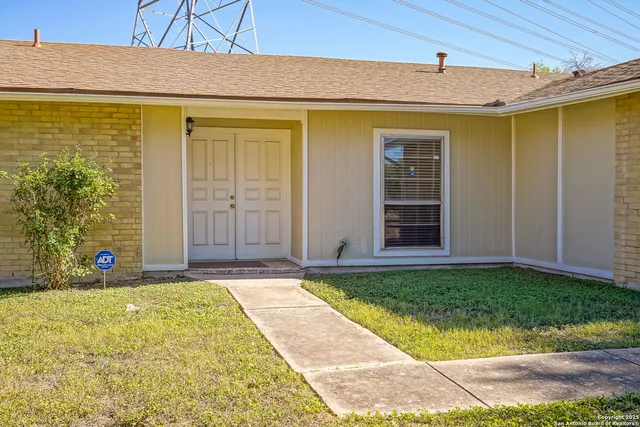 a view of a backyard of the house