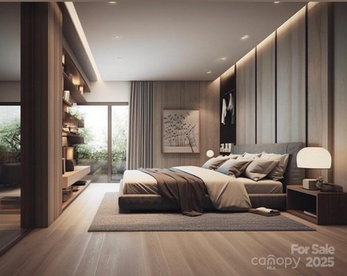 2859 Sharon Road Charlotte, NC 28211 - Photo 7 of 9 a bedroom with a large bed and a large window