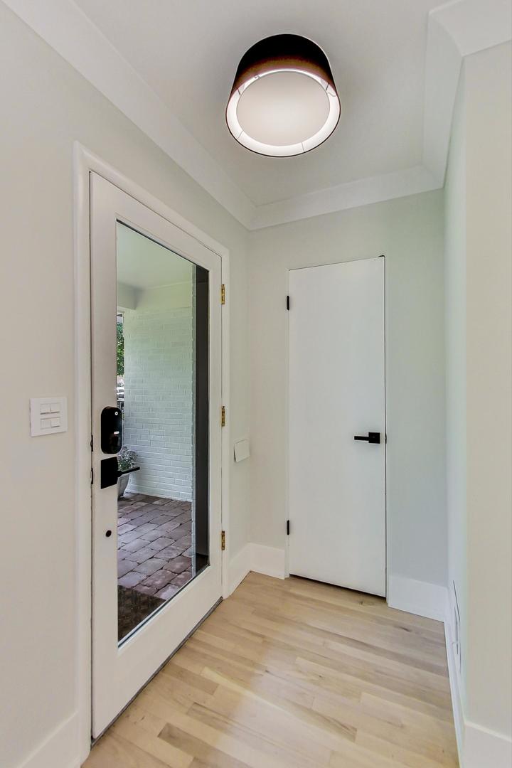 815 Locust Road Wilmette, IL 60091 - Photo 2 of 23 a view of a room with wooden floor and bathroom