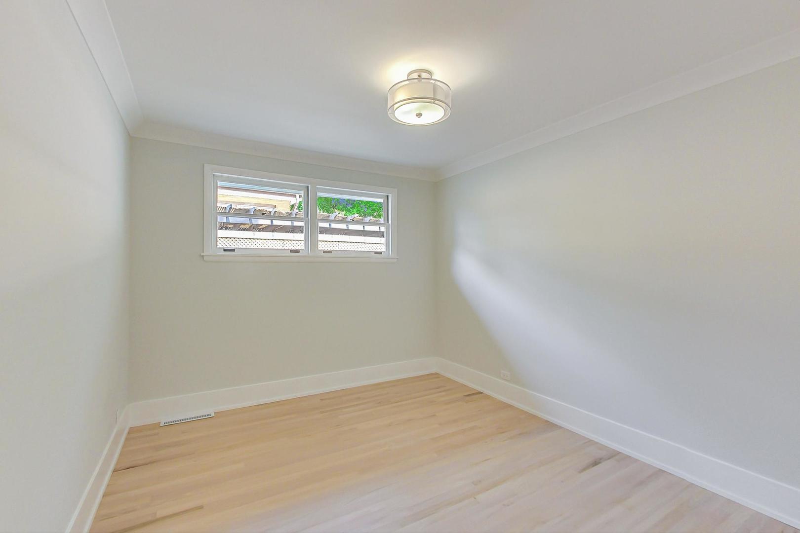 815 Locust Road Wilmette, IL 60091 - Photo 13 of 23 an empty room with a window