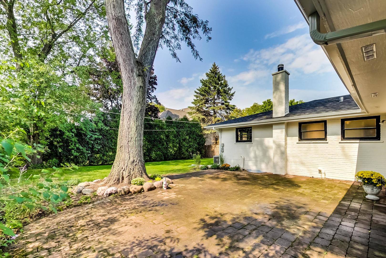 815 Locust Road Wilmette, IL 60091 - Photo 19 of 23 front view of a house with a yard