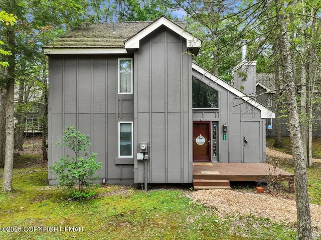 a backyard of a house with barbeque oven
