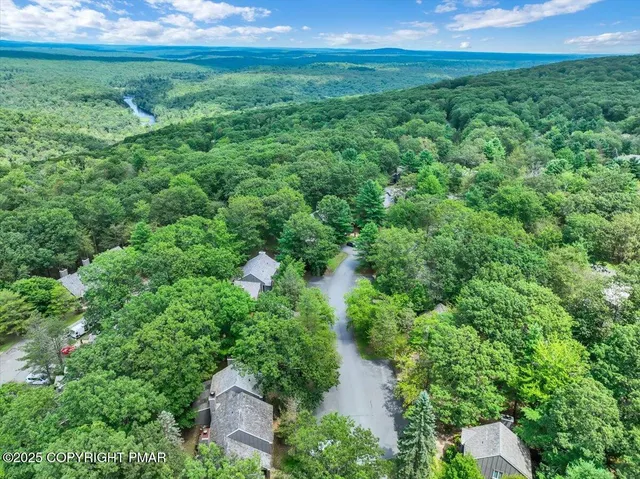 a view of a house with a tree park