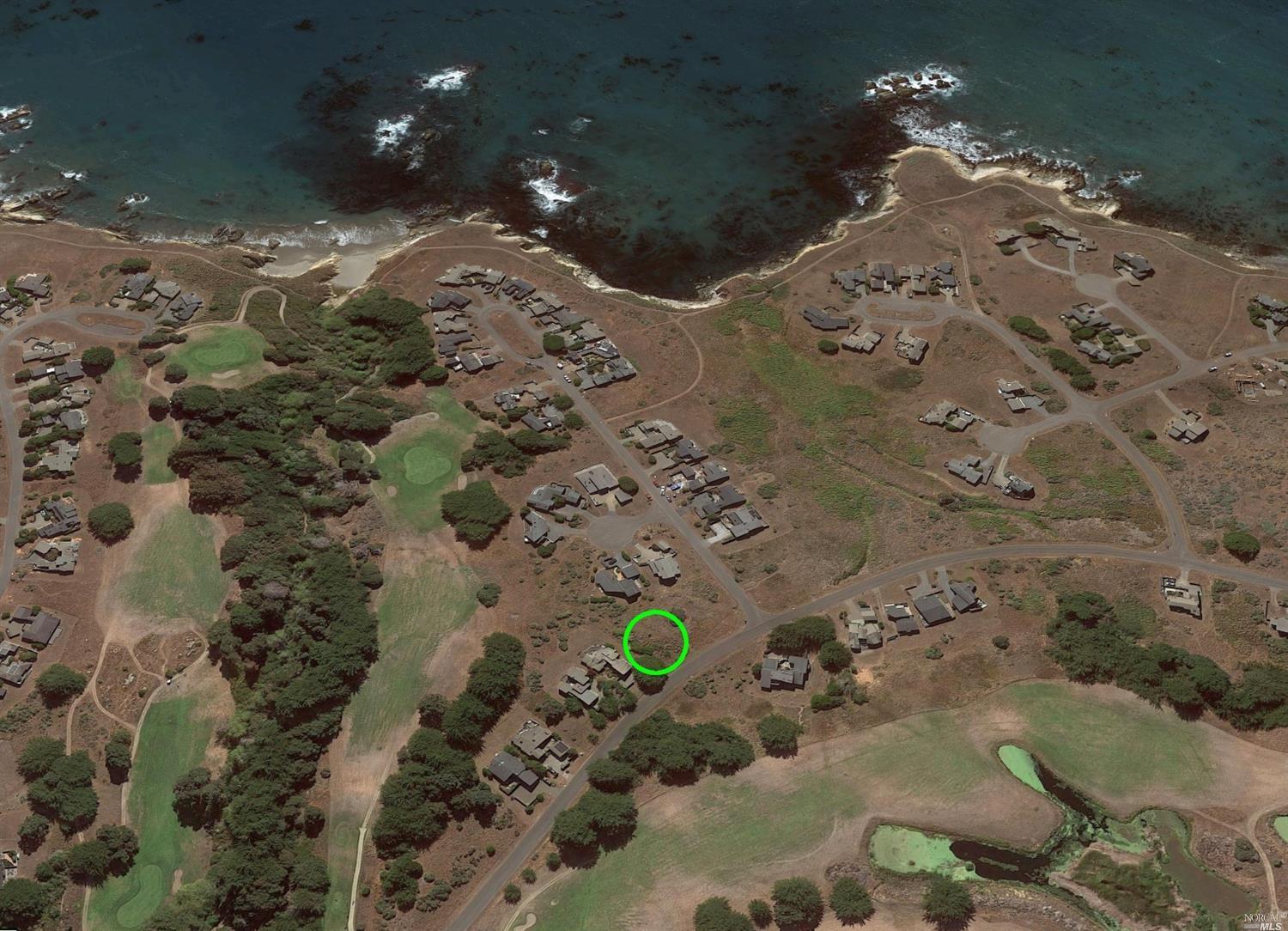 The lot is located at the circle. The corner is part of commons and will remain open land always.