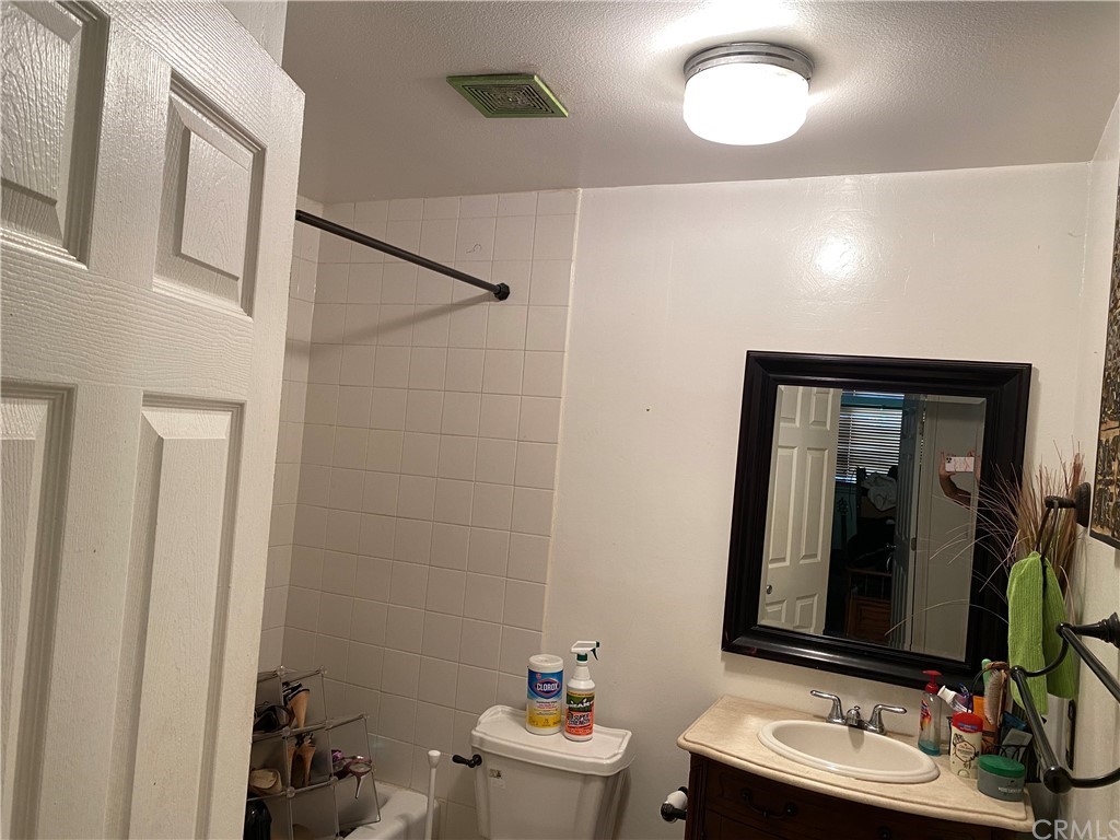 4684 Olive Street Montclair, CA 91763 - Photo 6 of 13 a bathroom with a sink and a mirror