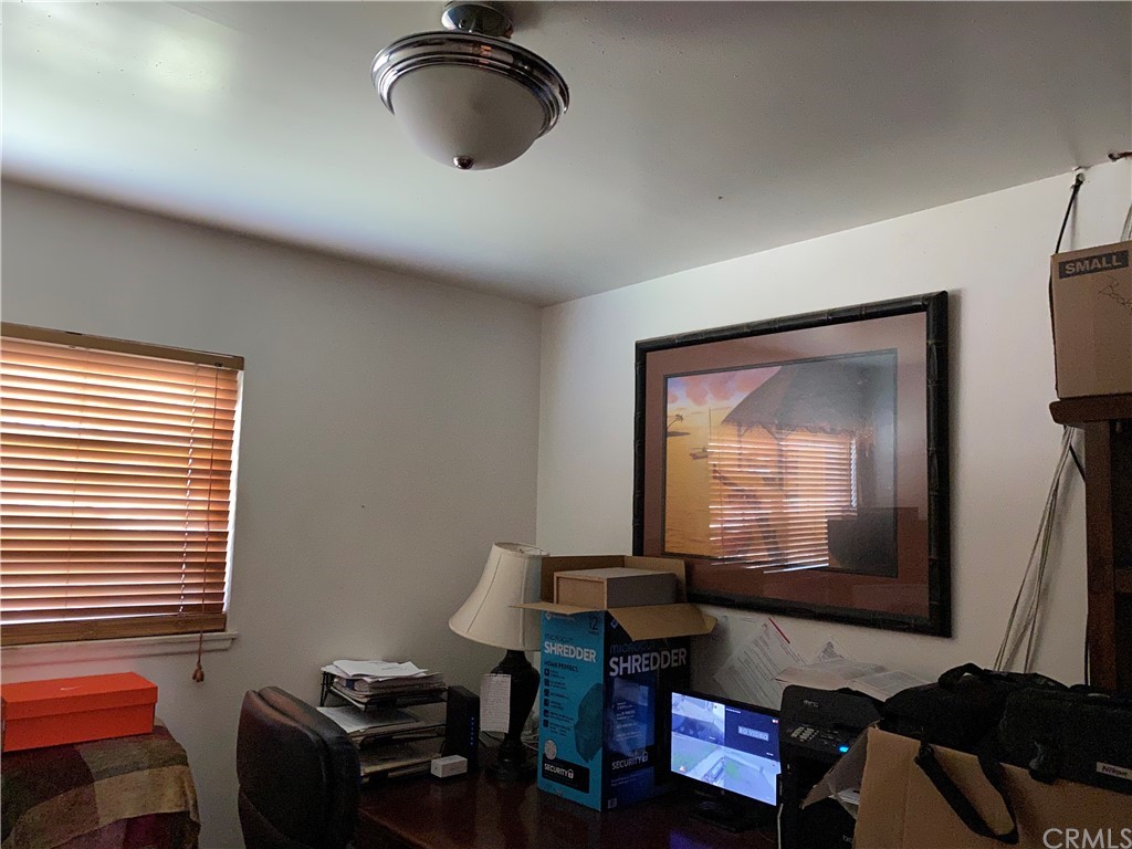 4684 Olive Street Montclair, CA 91763 - Photo 7 of 13 a living room with furniture and a window