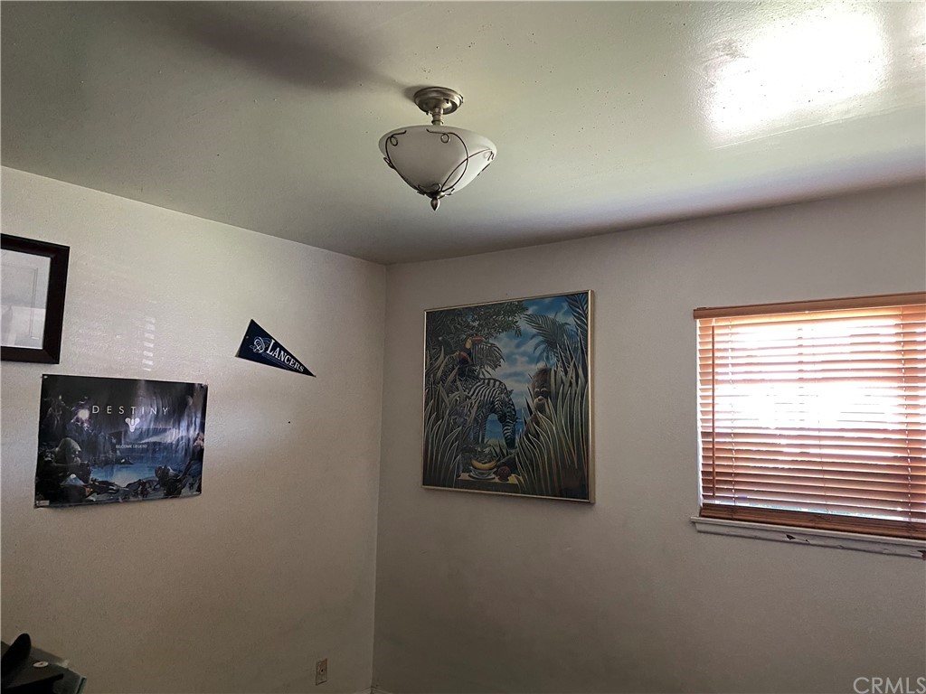 4684 Olive Street Montclair, CA 91763 - Photo 8 of 13 a view of a livingroom with a camera next to a window