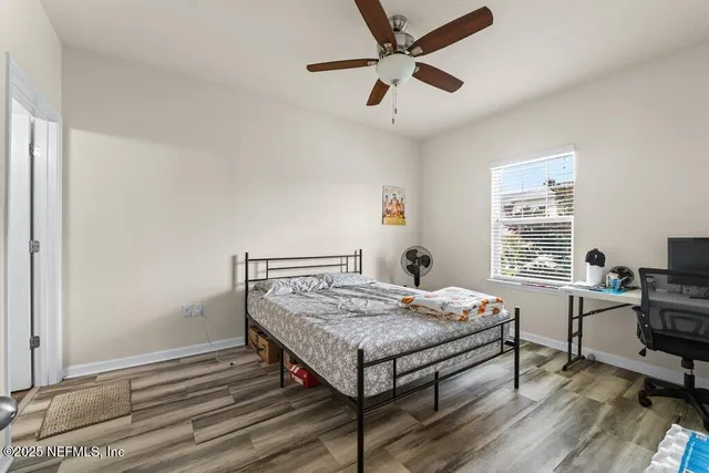 a bedroom with a bed and a table in it