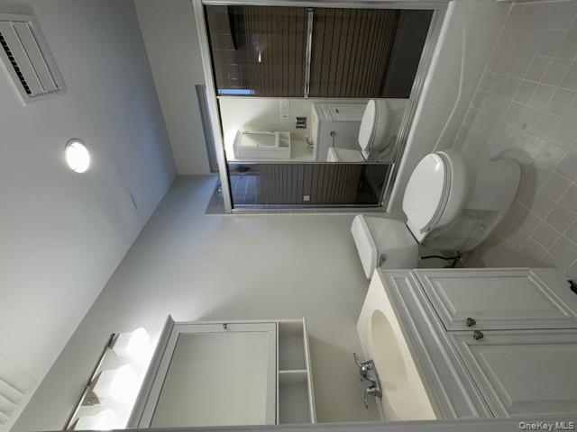 707 Lenox Road Monroe, NY 10950 - Photo 15 of 21 a bathroom with a sink a toilet and shower