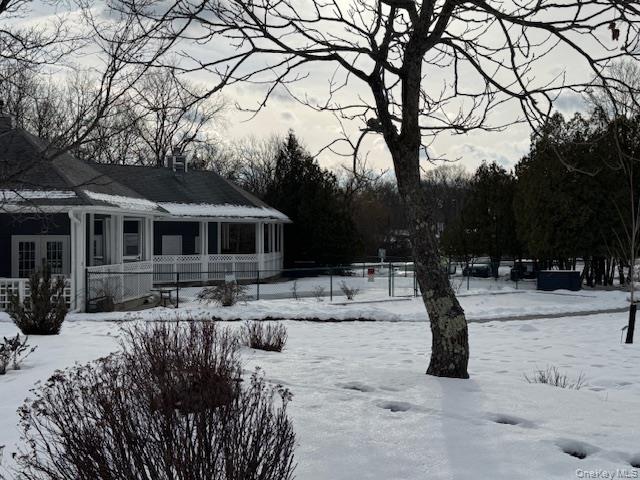 707 Lenox Road Monroe, NY 10950 - Photo 20 of 21 a front view of a house with a yard covered in snow