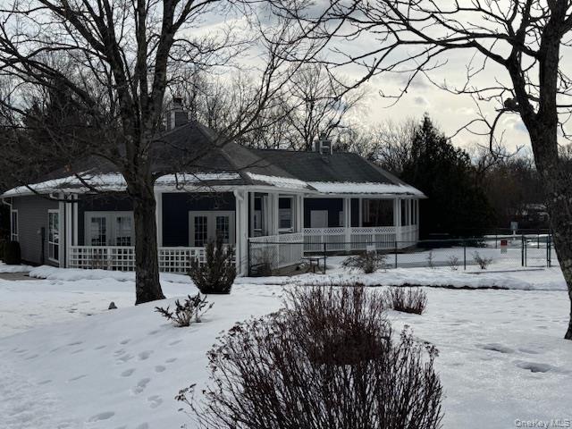 707 Lenox Road Monroe, NY 10950 - Photo 21 of 21 a front view of a house with a yard covered in snow