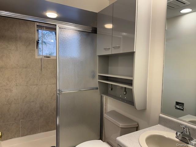 707 Lenox Road Monroe, NY 10950 - Photo 10 of 21 a bathroom with a toilet and a shower