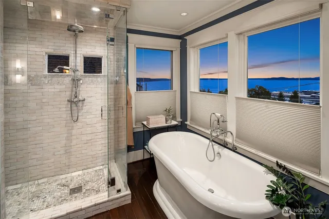 a bathroom with a tub and a shower
