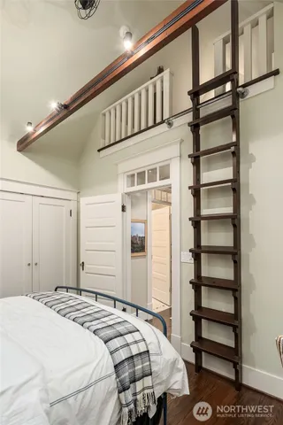 a bedroom with a bed and a walk in closet