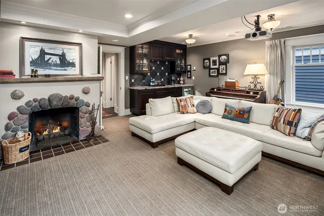 a living room with furniture and a fireplace