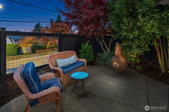 a view of a chair and tables in the patio