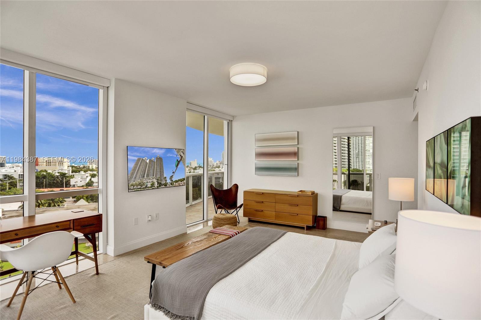 400 Alton Road, Unit 911 Miami Beach, FL 33139 - Photo 19 of 47 a bedroom with a bed and a large window
