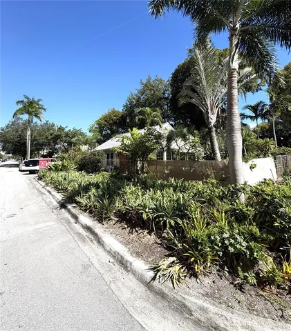 a view of street with flower plants