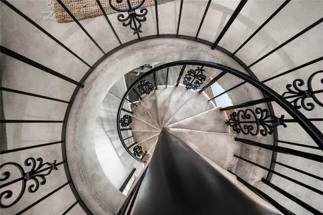 a bedroom with a bed and a chair