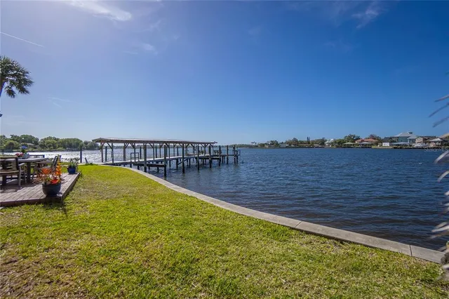 a view of a swimming pool with a yard