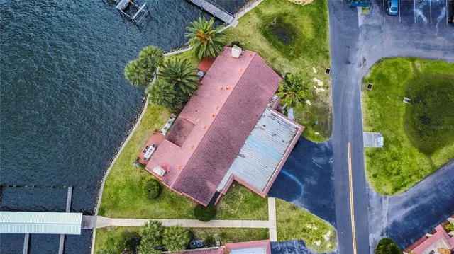 an aerial view of a houses with a lake view