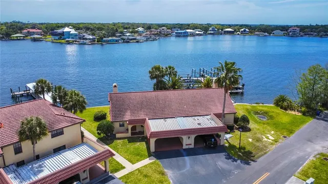 a view of a house with backyard and porch