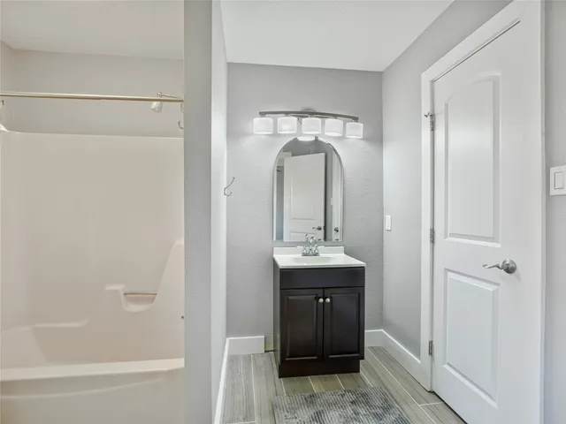 a view of a bathroom from the hallway