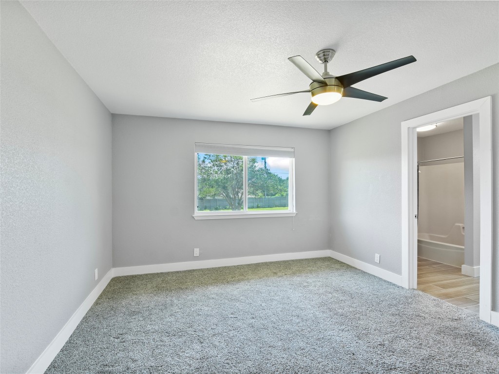 1612 Shenandoah Drive Cedar Park, TX 78613 - Photo 18 of 40 an empty room with a window and a fan