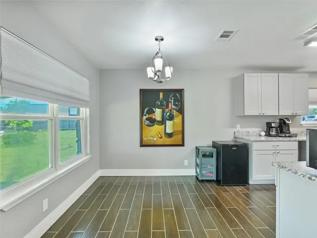 a kitchen with a sink and a stove top oven