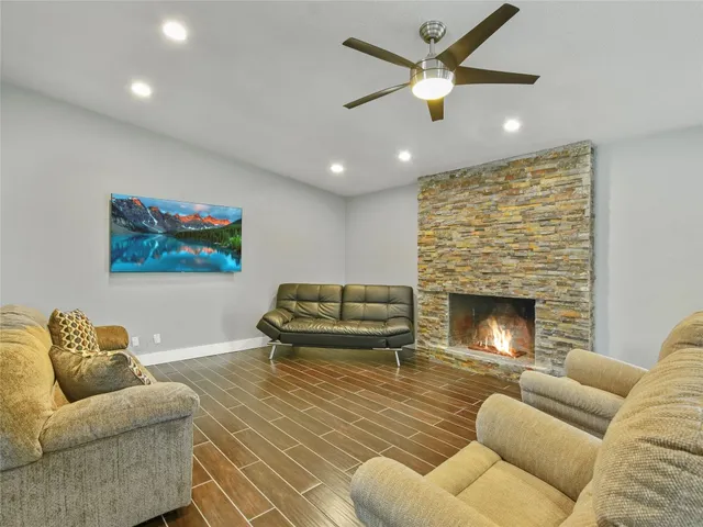 a living room with furniture and a fireplace