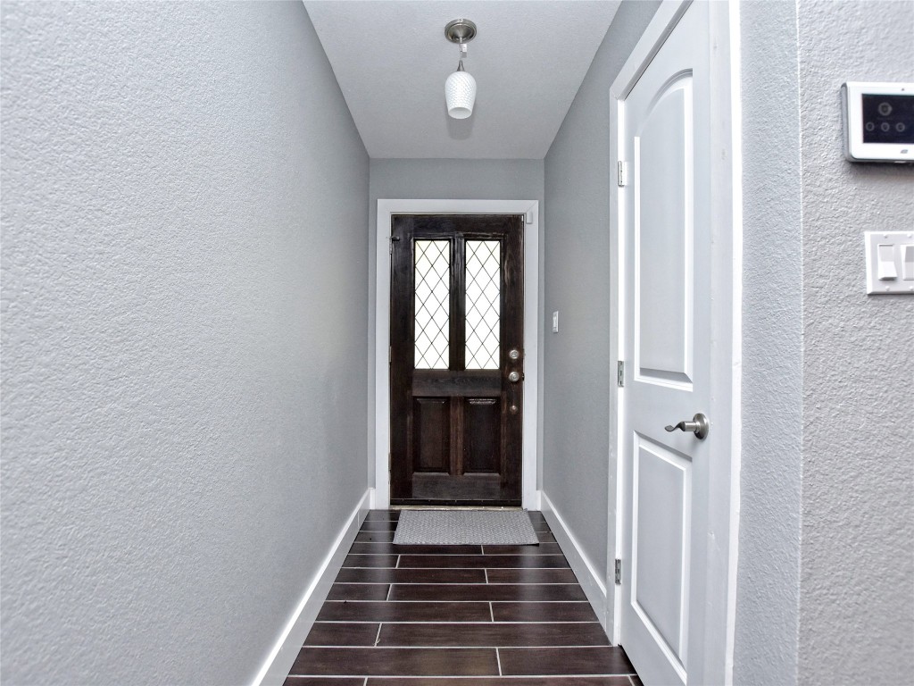 1612 Shenandoah Drive Cedar Park, TX 78613 - Photo 28 of 40 a view of a hallway with wooden floor and staircase