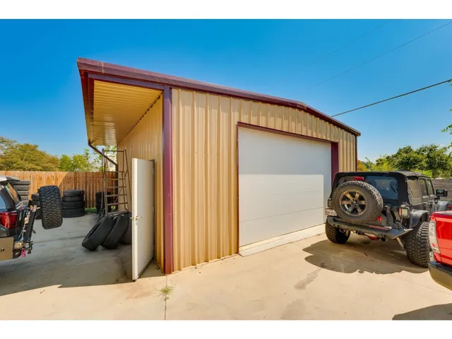 a view of a garage with cars