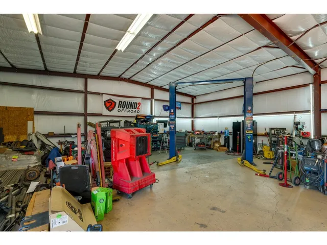 a view of a garage with a bike and car