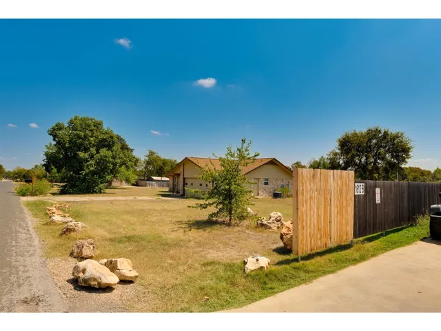 a view of a backyard of the house