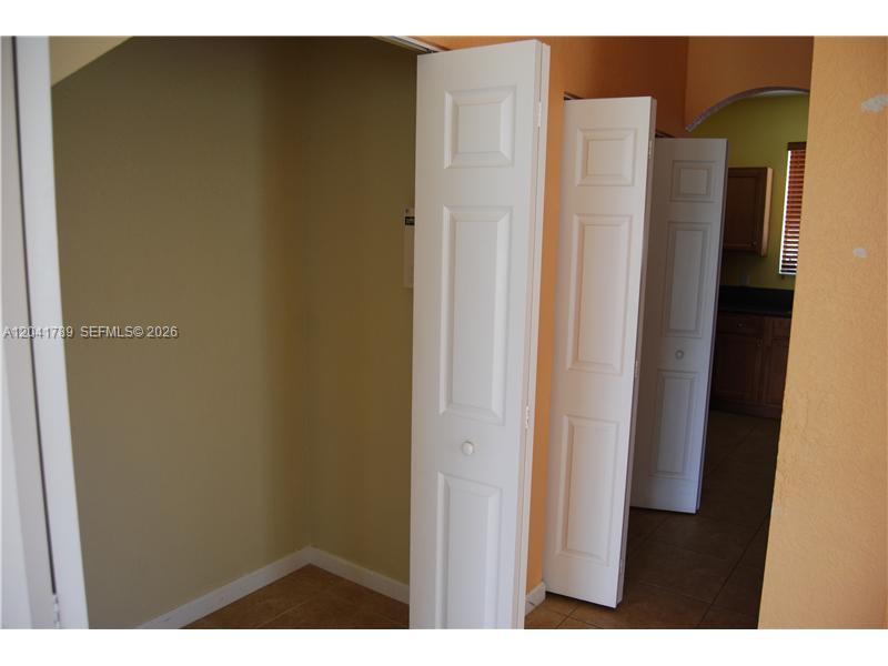 12080 Southwest 268th Street, Unit 24 Homestead, FL 33032 - Photo 5 of 29 a view of closet