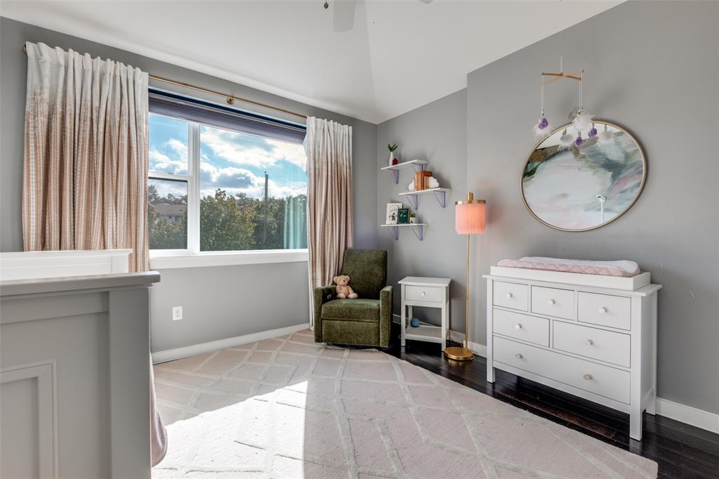 5311 Anita Street Dallas, TX 75206 - Photo 17 of 20 a room with a baby crib and a window