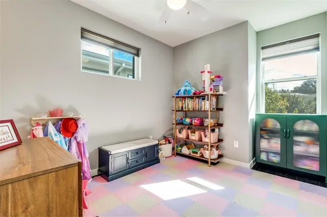 a bedroom with furniture and a baby crib