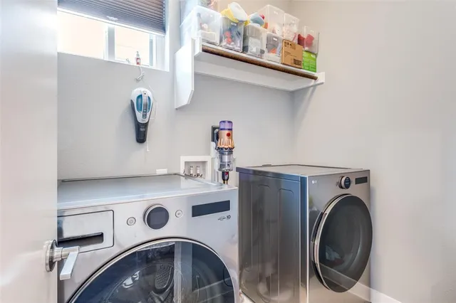 a utility room with dryer and washer