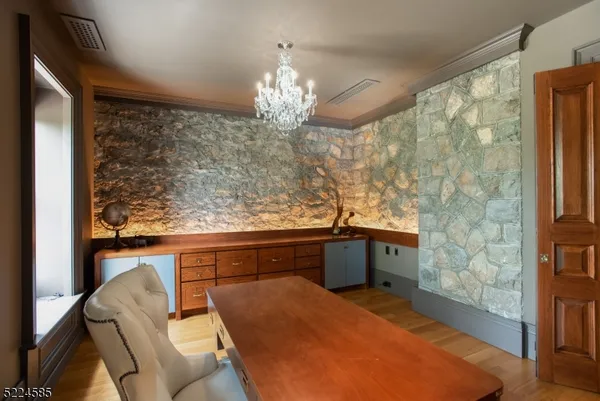 a spacious bathroom with a granite countertop sink a large mirror and a shower