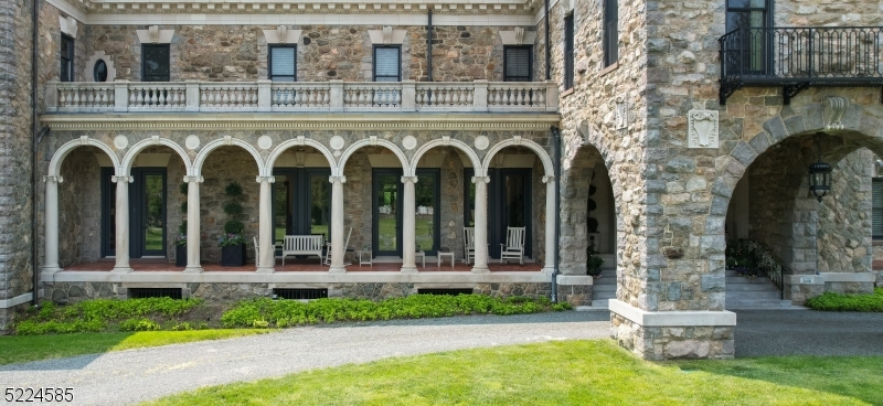 450 Claremont Road Bernardsville, NJ 07924 - Photo 36 of 47 a front view of a house with garden and plants