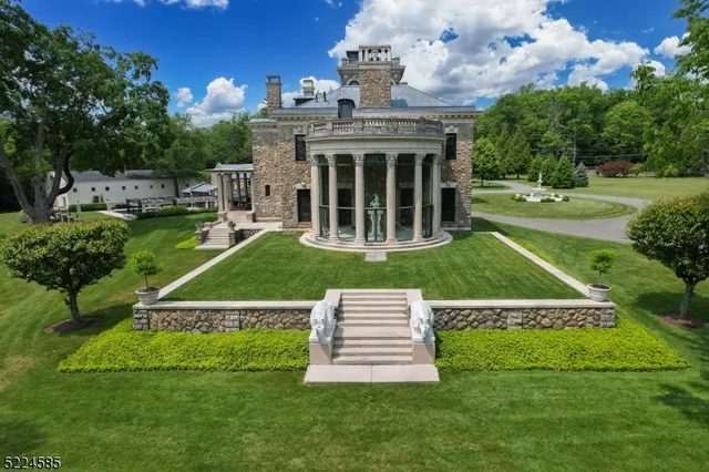 an aerial view of a house with a yard basket ball court and trampoline