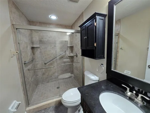 a kitchen with a refrigerator and a sink