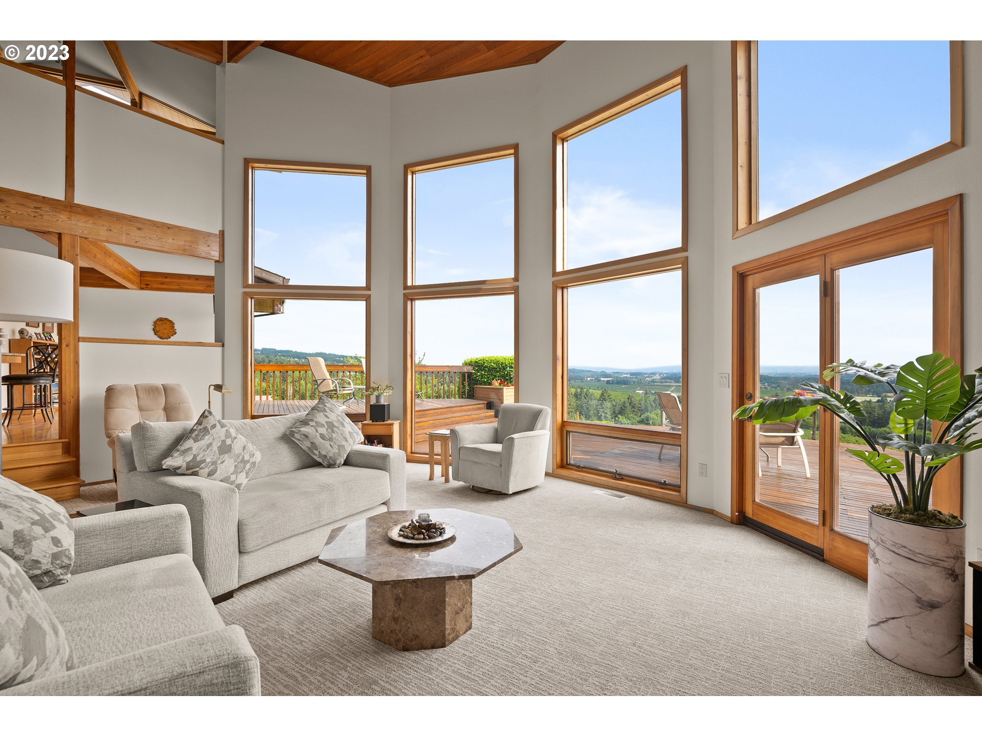 30875 Southwest Laurelview Road Hillsboro, OR 97123 - Photo 11 of 36 a living room with furniture and floor to ceiling windows