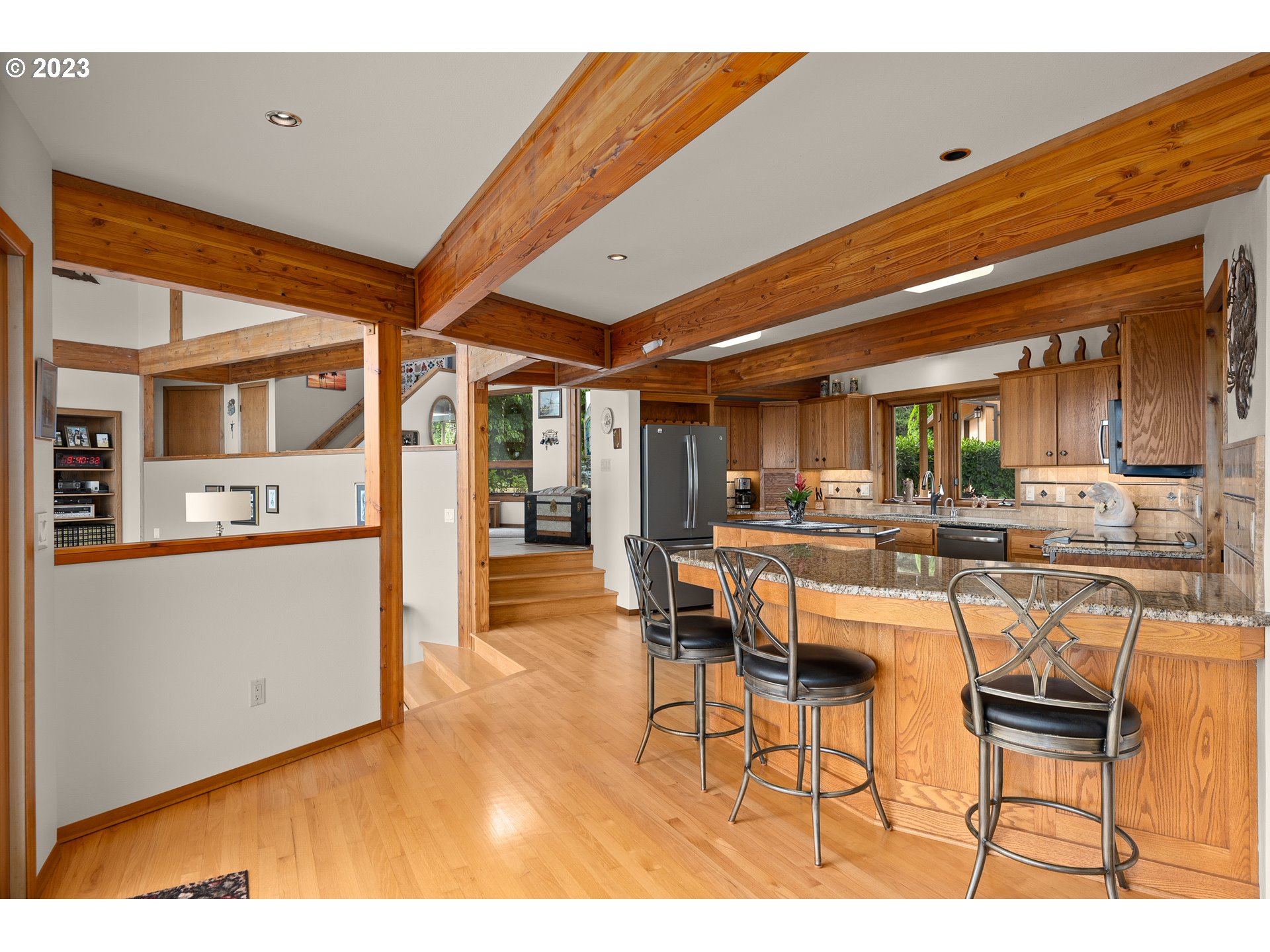 30875 Southwest Laurelview Road Hillsboro, OR 97123 - Photo 14 of 36 a dining room with furniture and a kitchen view