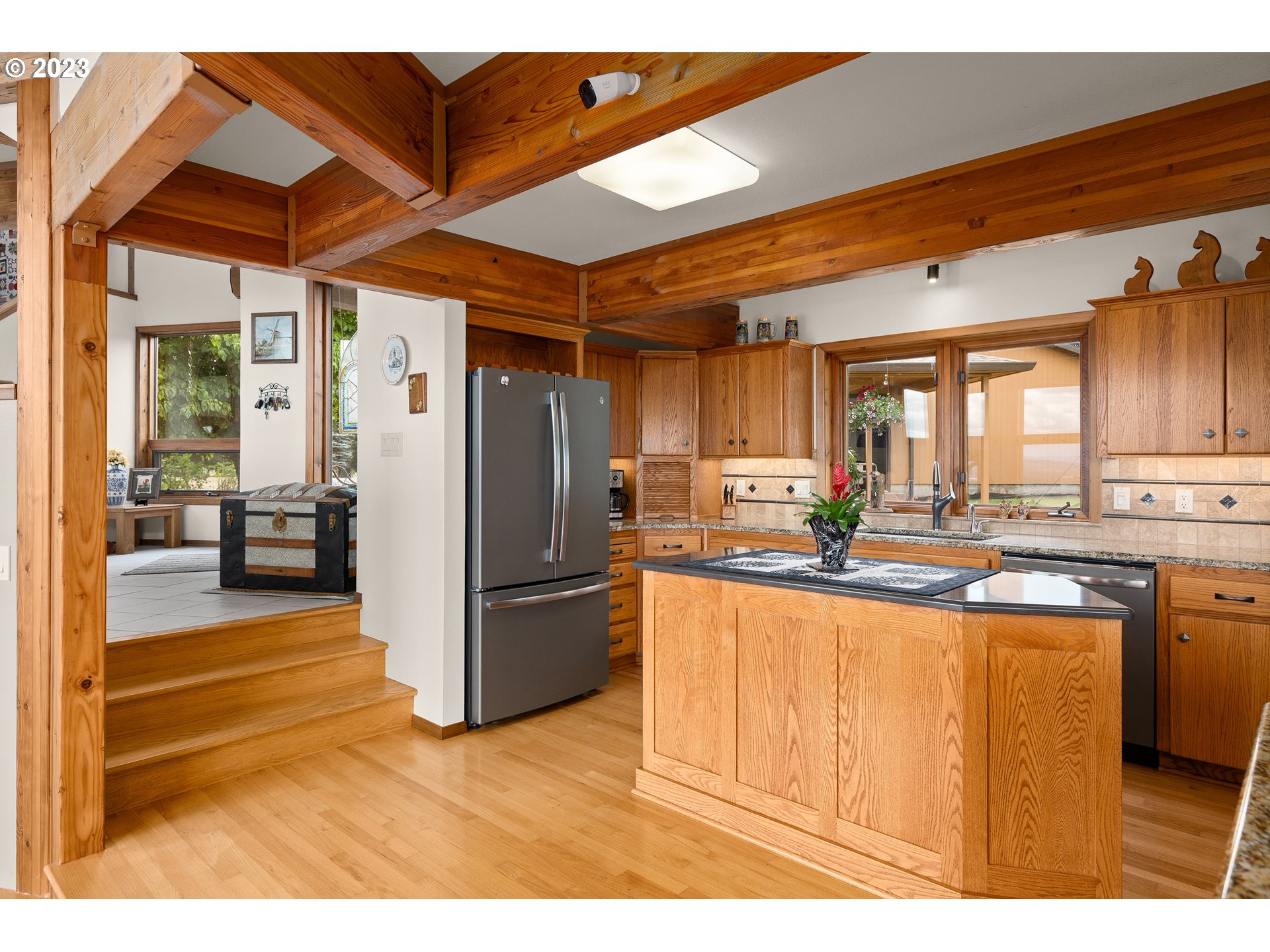 30875 Southwest Laurelview Road Hillsboro, OR 97123 - Photo 15 of 36 a kitchen with stainless steel appliances granite countertop a refrigerator and a sink